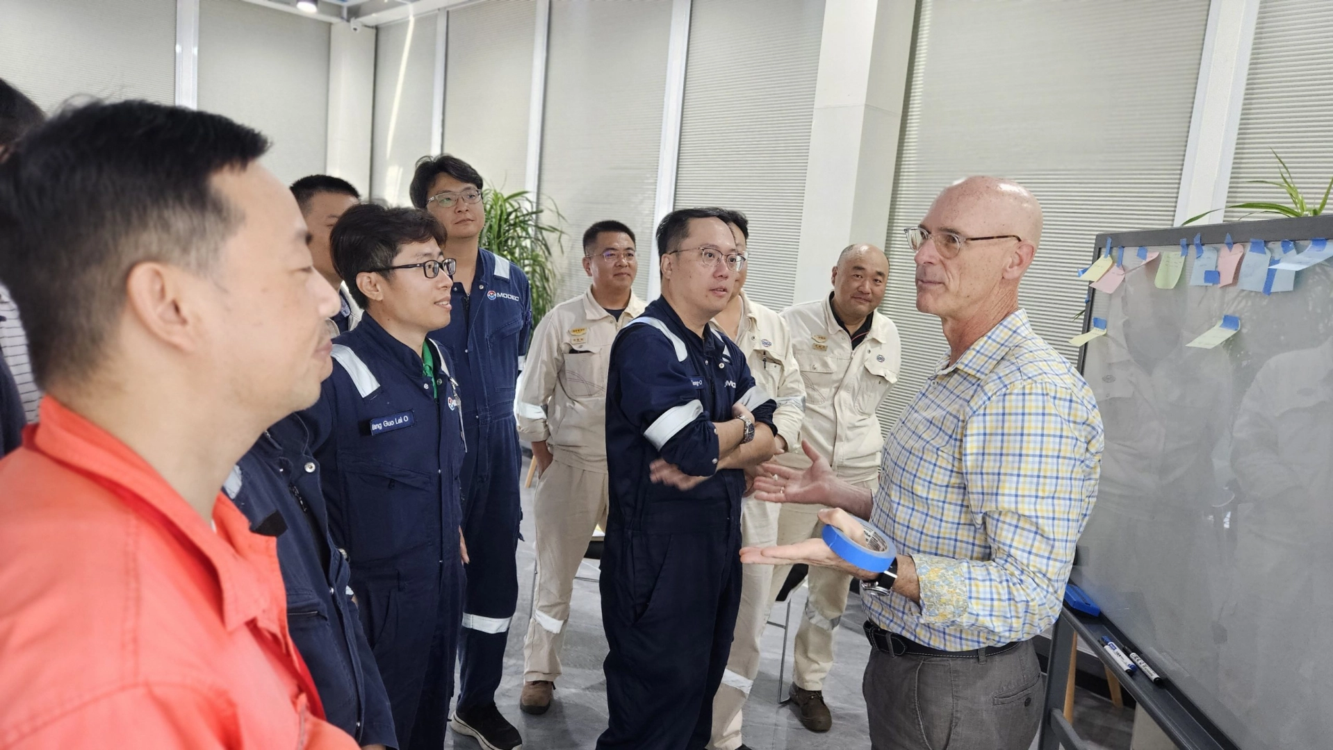 Leaders learning together in a roundtable coaching session