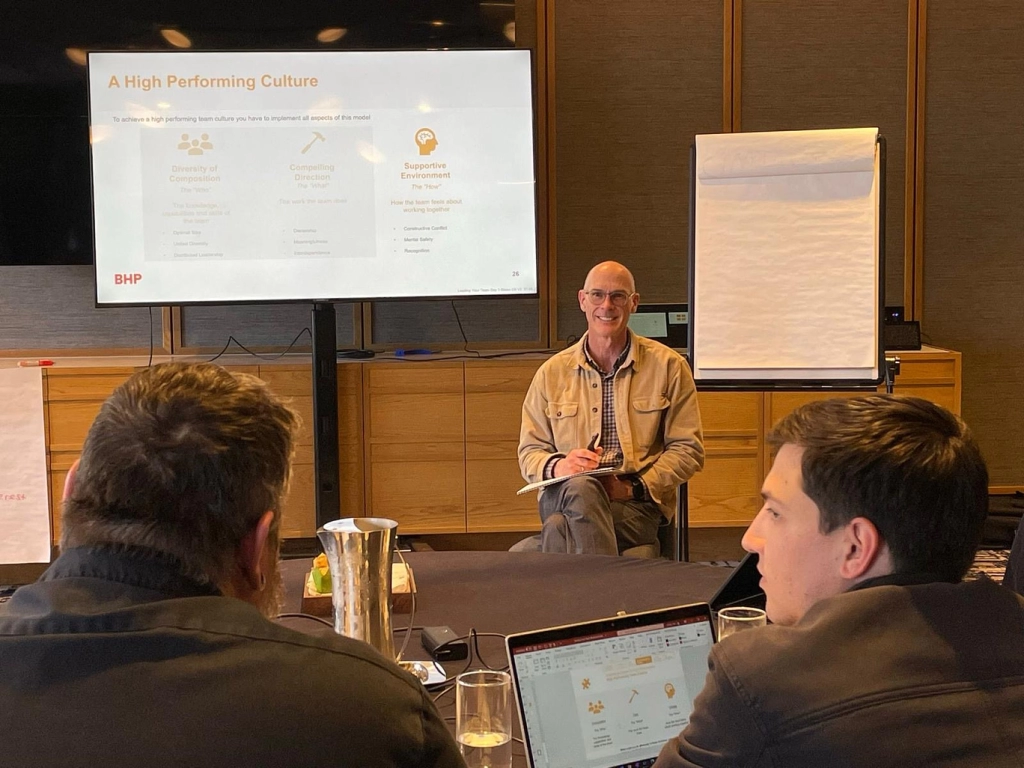 Leadership workshop with keynote speaker discussing high performing culture.